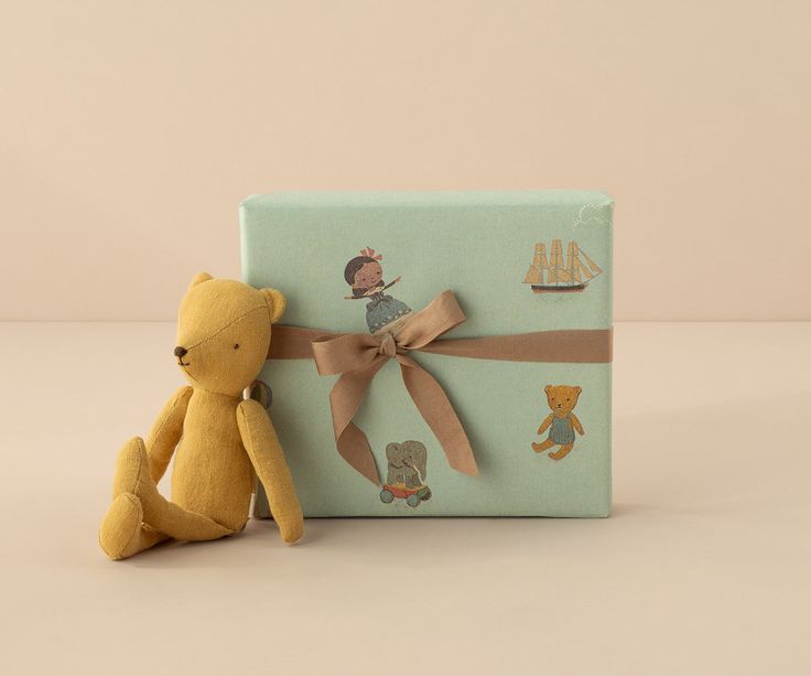 Wrapped gift beside a Montessori-style toddler toy